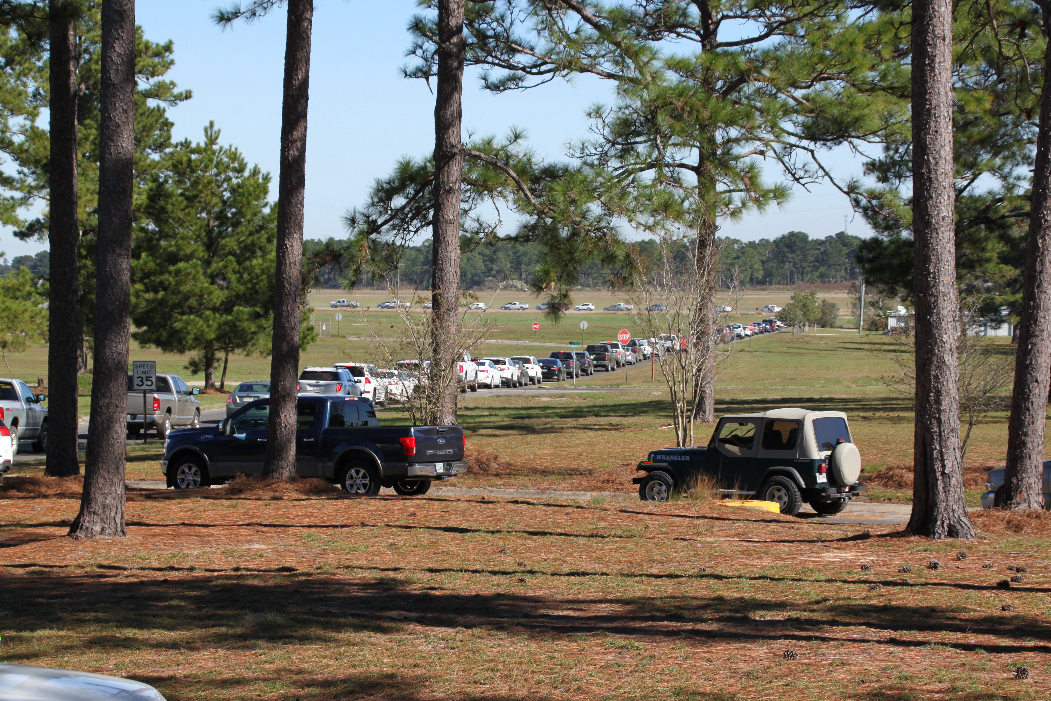 a long line of EMC members cars lined up for the drive-thru annual meeting